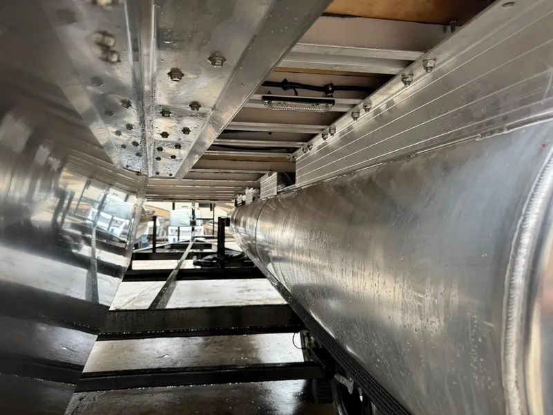 Slide: The Image of Underneath view of 2023 Frontier 24' Cruiser boat, showcasing aluminum structure and craftsmanship. - 27