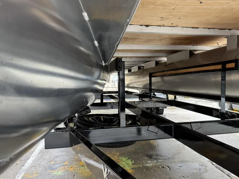 Slide: The Image of Underneath view of 2023 Frontier 24' Cruiser boat, showcasing its structural framework. - 28