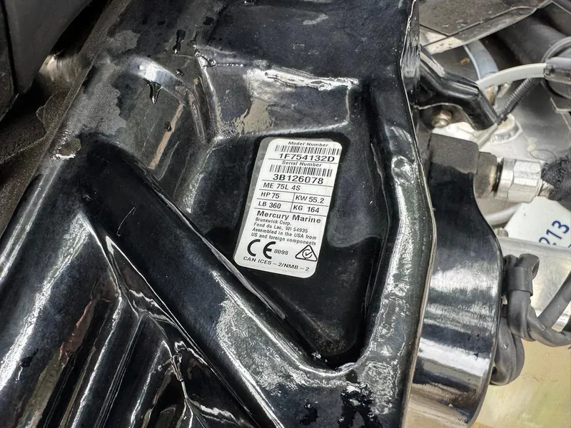 Slide: The Image of Close-up of a Mercury Marine engine label on a 2023 Frontier 24' Cruiser. - 33