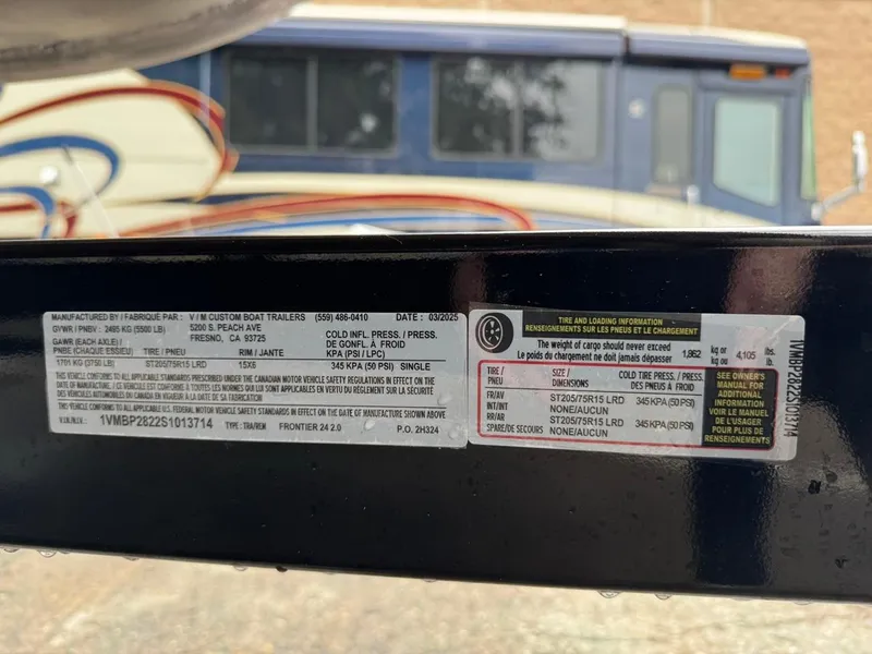 Slide: The Image of Sticker on a 2023 Frontier 24' Cruiser trailer showing tire and loading information. - 35