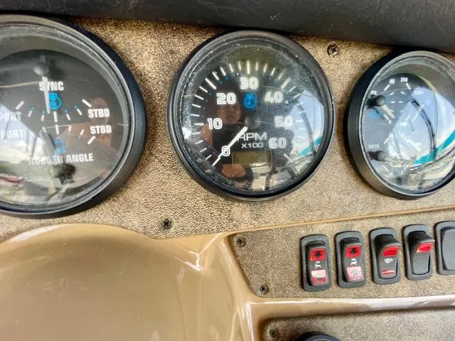 Slide: The Image of Dashboard of a 2003 Carver 360 Sport Sedan with gauges and switches. - 14