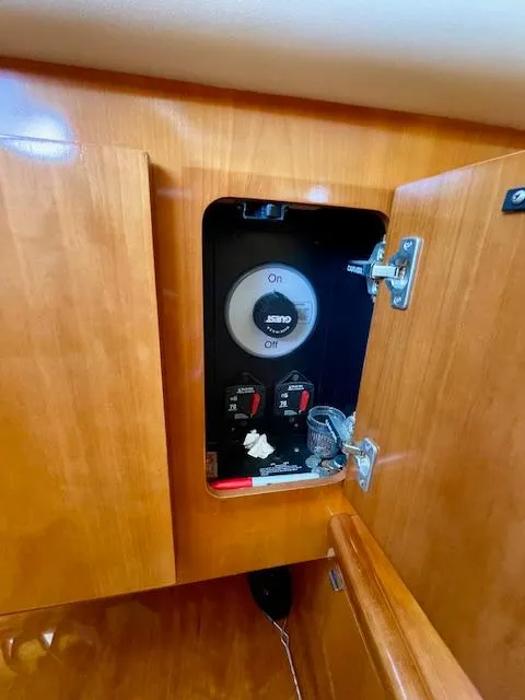 Slide: The Image of Electrical panel inside a 2003 Carver 360 Sport Sedan boat cabinet. - 31