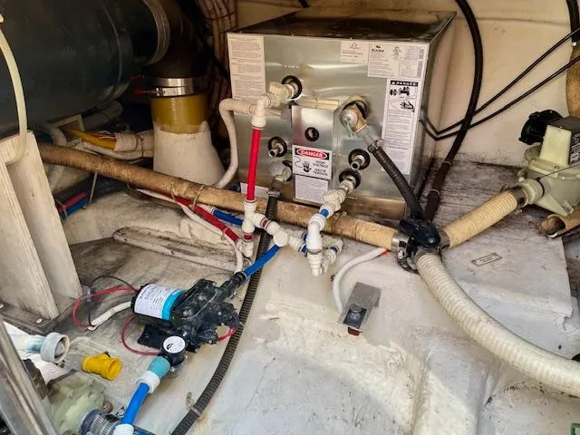 Slide: The Image of Engine room of a 2003 Carver 360 Sport Sedan with plumbing and equipment. - 49