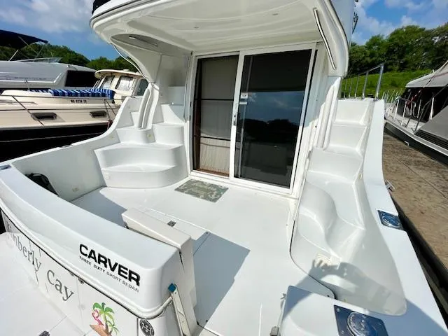 Slide: The Image of 2003 Carver 360 Sport Sedan yacht with spacious deck and sliding glass doors. - 7