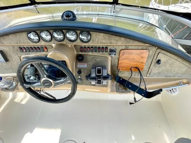 Slide: The Image of 2003 Carver 360 Sport Sedan dashboard with steering wheel and instrument panel. - 11