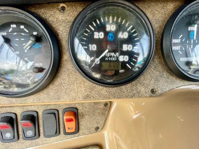 Slide: The Image of Dashboard of a 2003 Carver 360 Sport Sedan with gauges and control switches. - 13