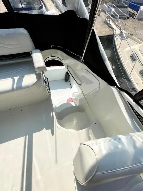 Slide: The Image of 2003 Carver 360 Sport Sedan interior with white seating and black accents. - 20