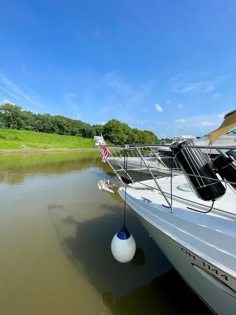 Slide: The Image of 2003 Carver 360 Sport Sedan docked on a sunny day by a riverbank. - 3