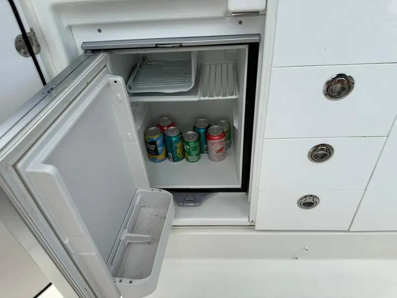 Slide: The Image of Mini fridge with drinks on Jeanneau Leader 10.5 boat, 2018 model. - 11