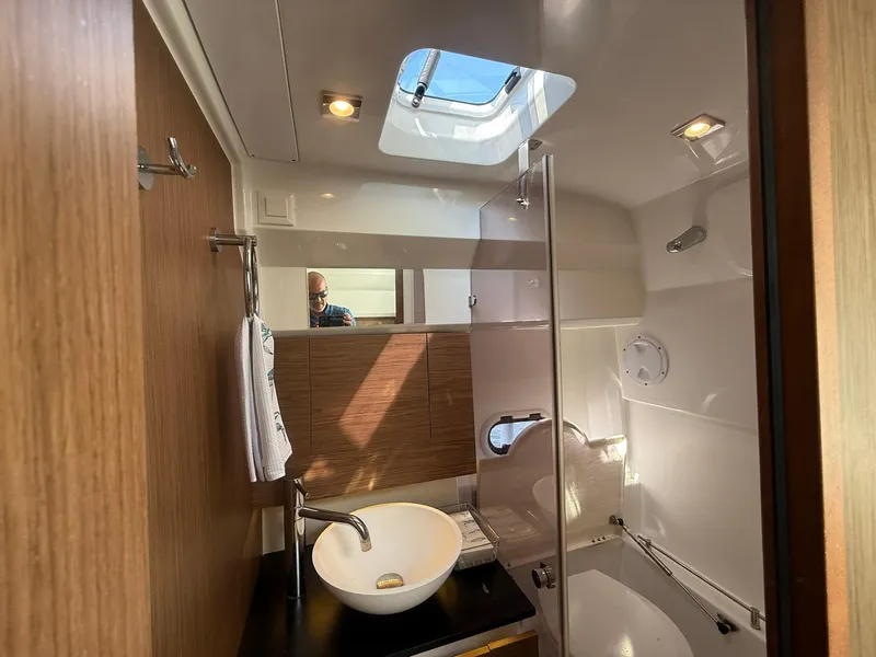 Slide: The Image of Modern bathroom interior of 2018 Jeanneau Leader 10.5 yacht with skylight and sleek fixtures. - 22