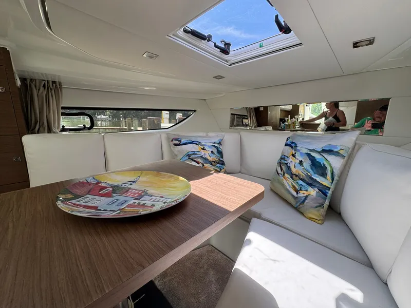 Slide: The Image of Interior of 2018 Jeanneau Leader 10.5 yacht with cozy seating and decorative pillows. - 31