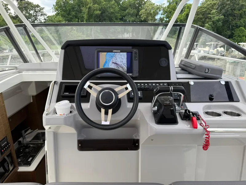Slide: The Image of Helm of 2018 Jeanneau Leader 10.5 with navigation system and controls. - 8