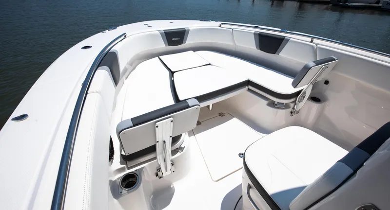 Slide: The Image of 2023 Robalo R270 Center Console boat interior with seating and cup holders. - 8