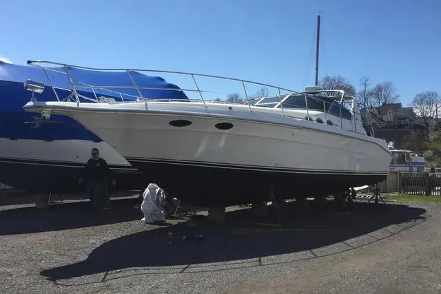 Slide: The Image of 1995 Sea Ray 400 Express Cruiser on dry dock, side view. - 1