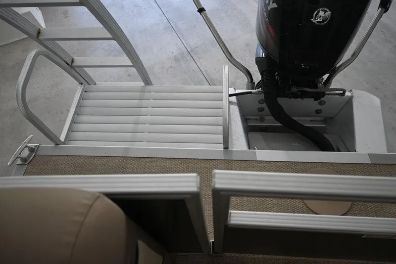 Slide: The Image of 2019 Bennington 22 SSR boat with ladder and outboard motor. - 10