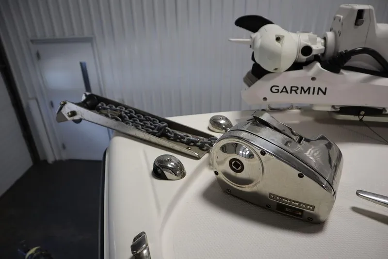 Slide: The Image of 2017 Mako 284 CC boat with Garmin equipment and anchor chain mechanism. - 10