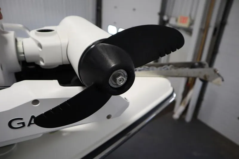 Slide: The Image of Close-up of a 2017 Mako 284 CC boat propeller in a garage setting. - 15