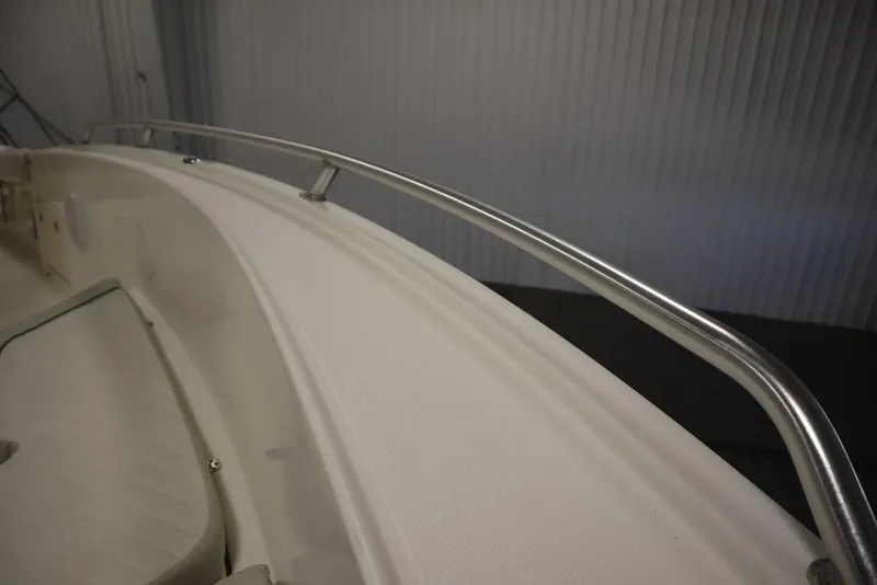 Slide: The Image of 2017 Mako 284 CC boat interior with stainless steel railing detail. - 21