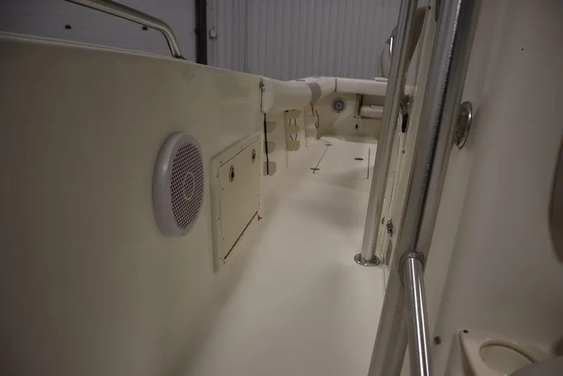 Slide: The Image of 2017 Mako 284 CC boat interior with speaker and storage compartment. - 26