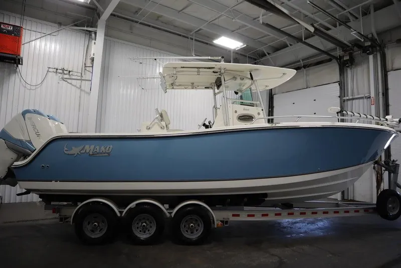 Slide: The Image of 2017 Mako 284 CC boat on trailer in indoor storage facility. - 6