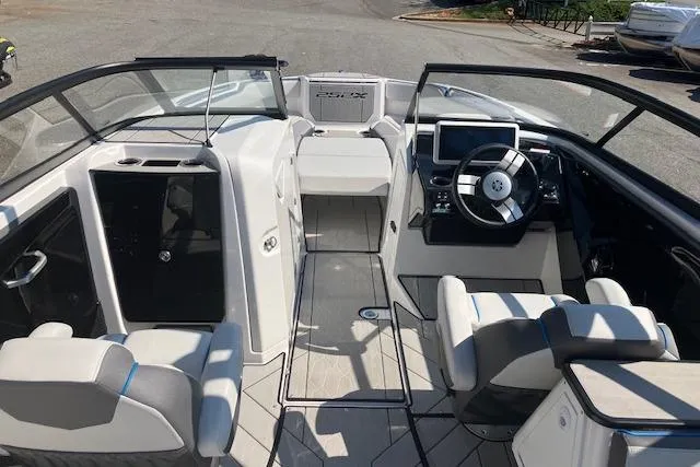 Slide: The Image of 2021 Yamaha Boats 252XE interior with modern dashboard and seating. - 14