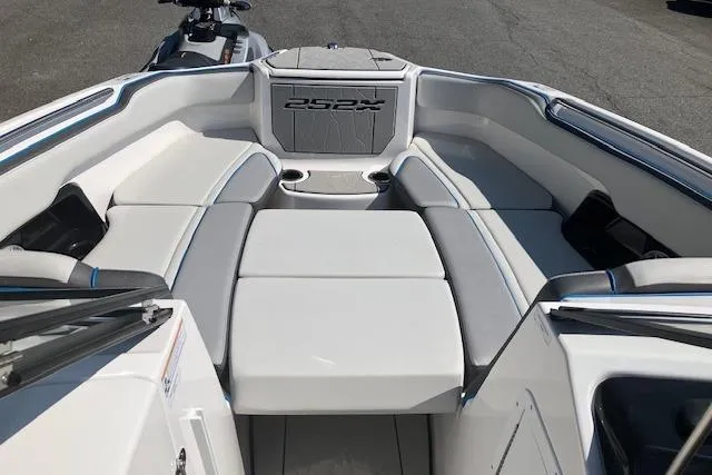 Slide: The Image of 2021 Yamaha Boats 252XE interior with spacious seating and modern design. - 16