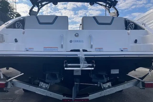 Slide: The Image of 2021 Yamaha Boats 252XE rear view, showcasing sleek design and dual seating. - 19