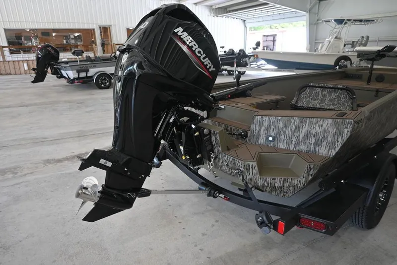 Slide: The Image of 2026 Thor 1754 Timber Hammer boat with Mercury outboard motor in a showroom. - 3