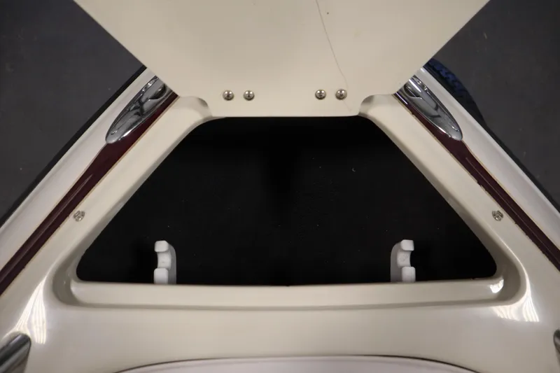 Slide: The Image of 2003 Crownline 202 BR boat interior detail, featuring sleek design and polished fittings. - 13