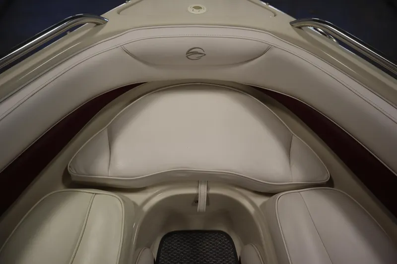Slide: The Image of 2003 Crownline 202 BR boat interior with white cushioned seating. - 14
