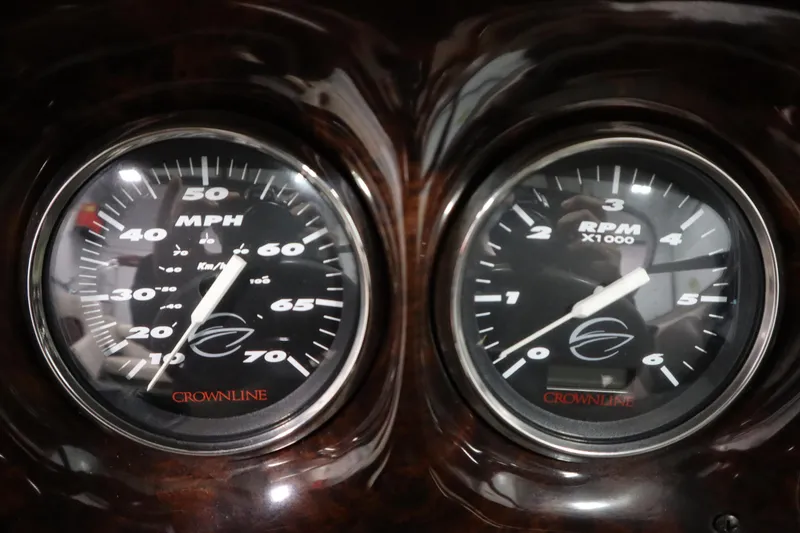 Slide: The Image of 2003 Crownline 202 BR dashboard with speedometer and tachometer gauges. - 24