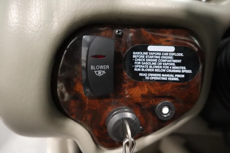 Slide: The Image of Control panel of a 2003 Crownline 202 BR boat with blower switch and safety instructions. - 29