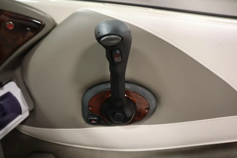 Slide: The Image of Throttle control lever in a 2003 Crownline 202 BR boat interior. - 31