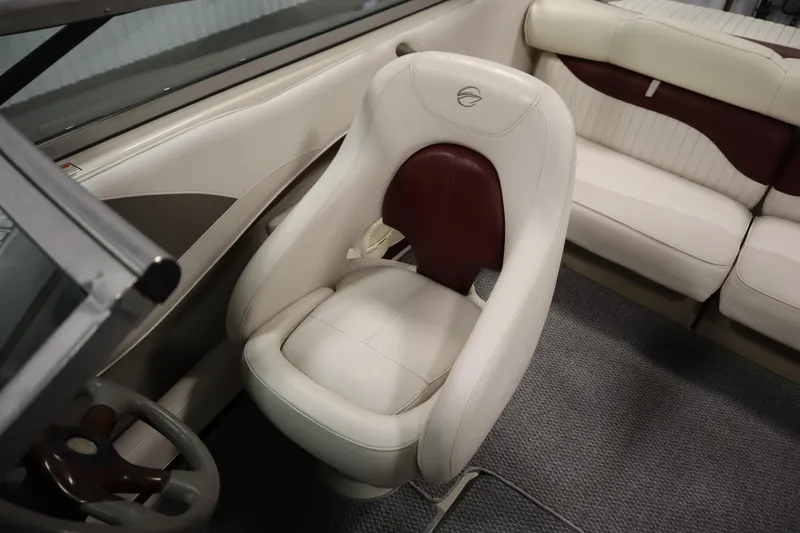 Slide: The Image of 2003 Crownline 202 BR boat interior with white and maroon seating. - 32