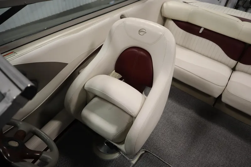 Slide: The Image of 2003 Crownline 202 BR boat interior with beige and maroon seating. - 33