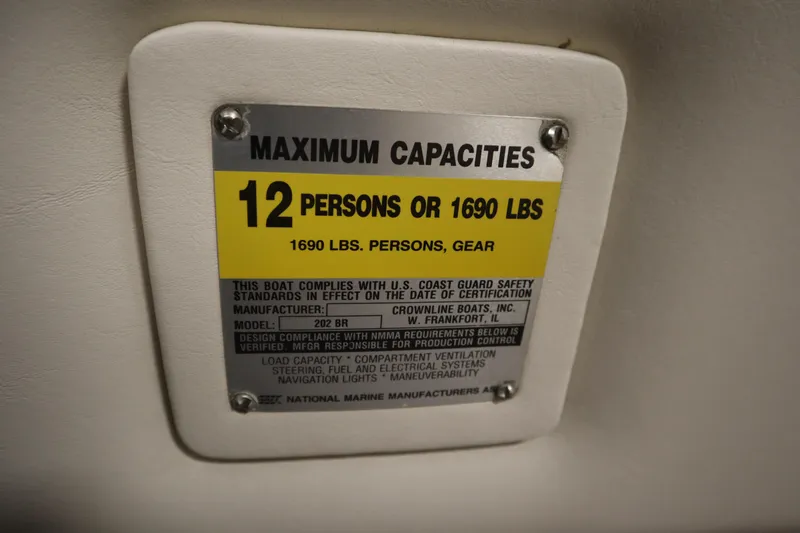 Slide: The Image of 2003 Crownline 202 BR capacity plate: 12 persons or 1690 lbs maximum load. - 34