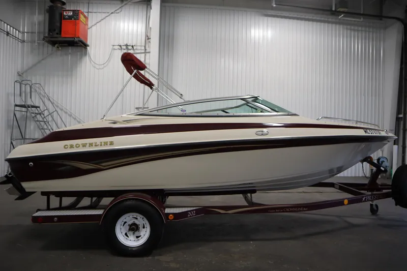 Slide: The Image of 2003 Crownline 202 BR boat on trailer in indoor storage facility. - 4