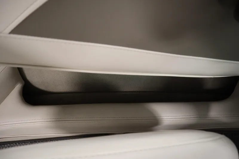 Slide: The Image of Interior detail of 2003 Crownline 202 BR boat, featuring white leather upholstery. - 40