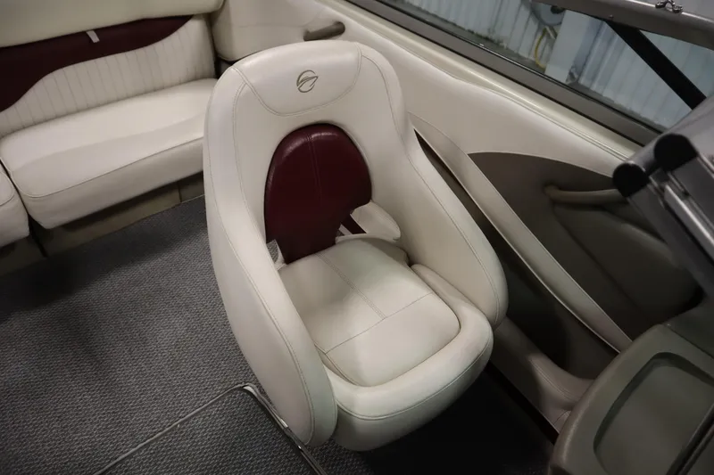 Slide: The Image of 2003 Crownline 202 BR boat interior with white and maroon seating. - 41