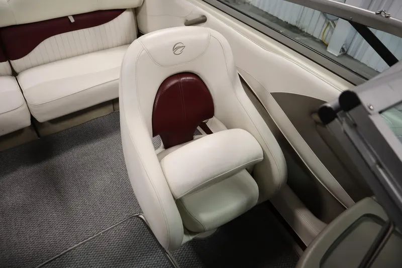 Slide: The Image of 2003 Crownline 202 BR boat interior with white and maroon seating. - 42
