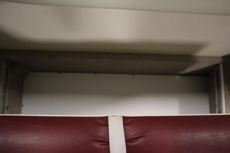 Slide: The Image of 2003 Crownline 202 BR boat interior with maroon and white upholstery detail. - 45