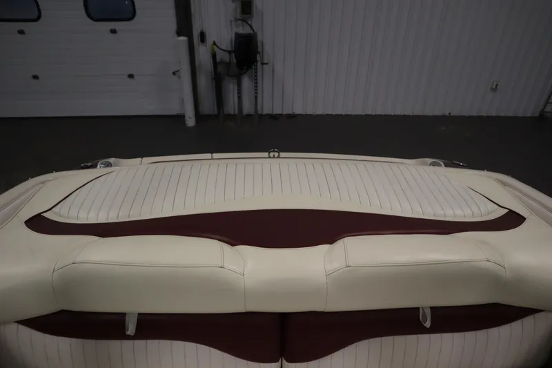 Slide: The Image of 2003 Crownline 202 BR boat interior with cream and maroon upholstery. - 47