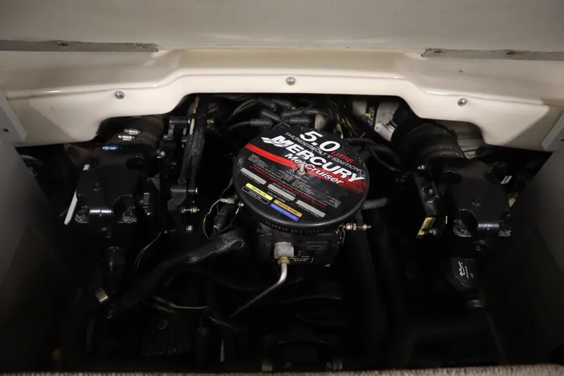 Slide: The Image of Engine compartment of a 2003 Crownline 202 BR with a Mercury 5.0L engine. - 48