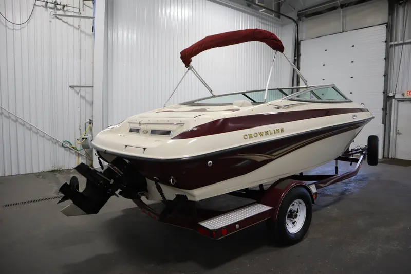 Slide: The Image of 2003 Crownline 202 BR boat on trailer in indoor storage facility. - 5