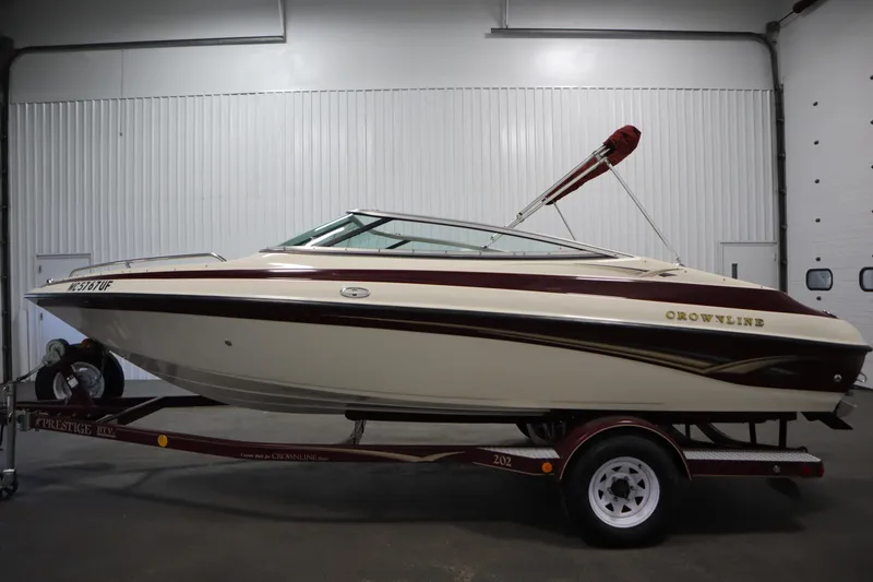 Slide: The Image of 2003 Crownline 202 BR boat on trailer in indoor storage facility. - 8