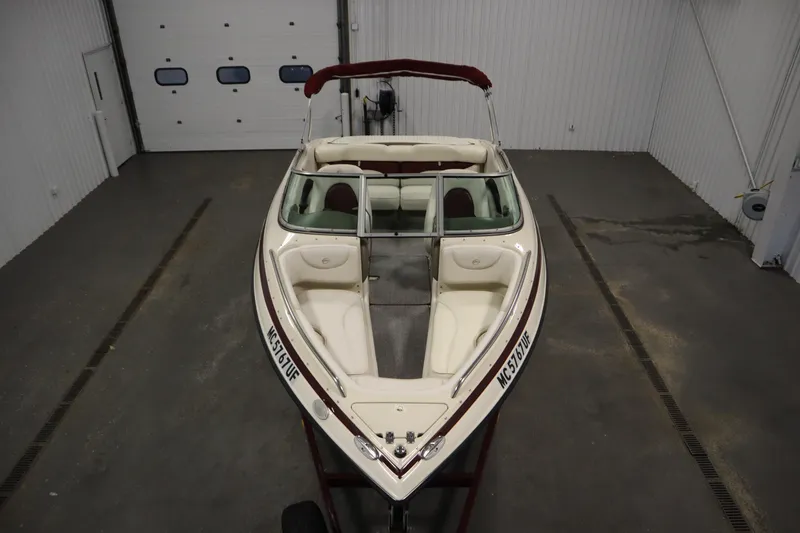 Slide: The Image of 2003 Crownline 202 BR boat in indoor storage, viewed from above. - 9