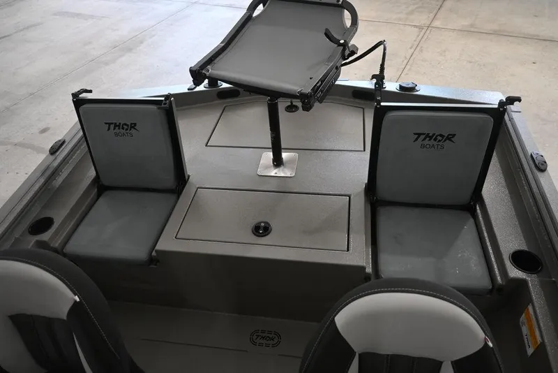 Slide: The Image of Interior of 2026 Thor Lake Hammer 1900SC boat with seating and storage compartments. - 10