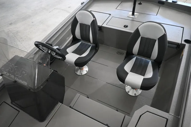 Slide: The Image of 2026 Thor Lake Hammer 1900SC boat interior with two black and white seats. - 5