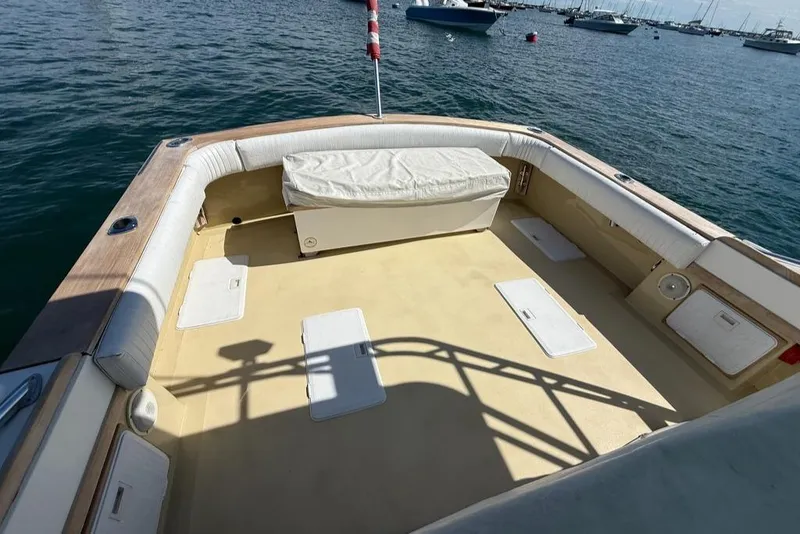 Slide: The Image of 1986 Dusky 26 Custom boat deck with seating, storage, and ocean view. - 10