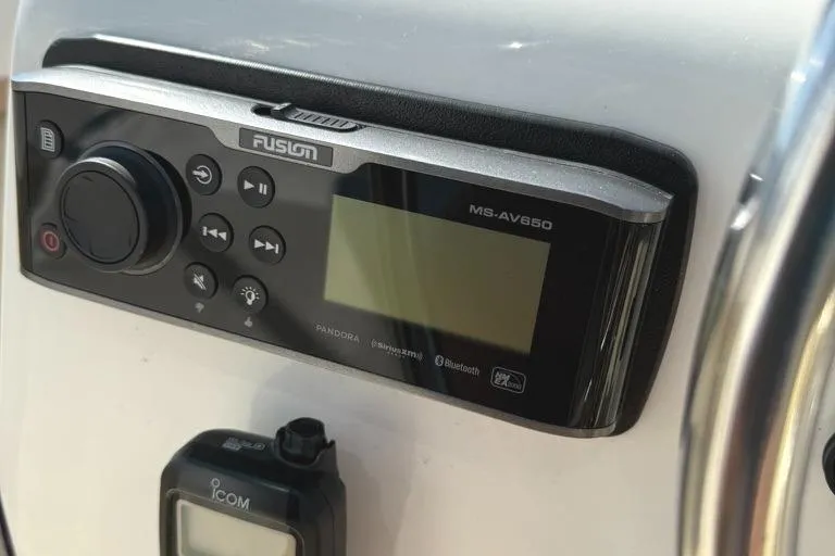 Slide: The Image of Fusion MS-AV650 marine stereo and Icom device on 1986 Dusky 26 Custom boat. - 12